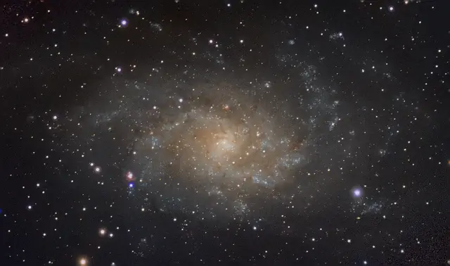 The Triangulum Galaxy (M33), its spiral arms dotted with star-forming regions